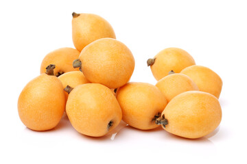 Close up view of some loquat fruit isolated on a white background 