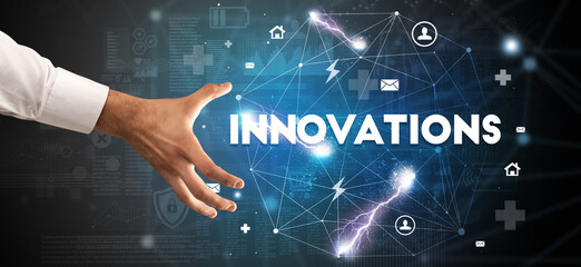 Hand pointing at INNOVATIONS inscription, modern technology concept