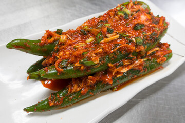 Korean kimchi green chili stuffed with carrots, green onions, garlic, fermented vegetables.