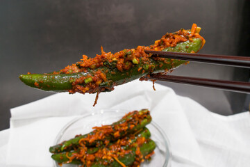 Korean kimchi green chili stuffed with carrots, green onions, garlic, fermented vegetables.