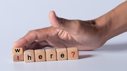 hand holding dice with text for illustration of "where and there" words 