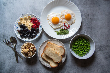 Healthy breakfast food ingredients on a background. Top view, selective focus.