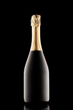 silhouette of closed bottle of champagne without label isolated on black background