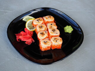 Japanese kitchen. Sushi and rolls on gray concrete background
