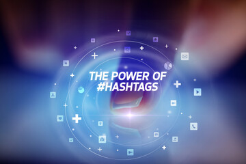 Finger touching tablet with social media icons and THE POWE OF #HASHTAGS