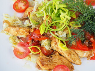 Chicken salad on blue wooden background