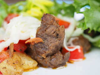 Meat salad on blue wooden background