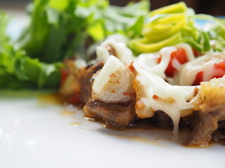 Meat salad on blue wooden background