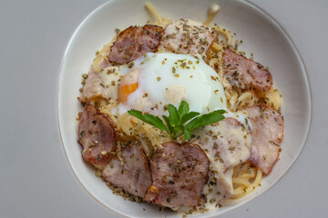 Italian food spaghetti carbonara that is decorated within plate beautifully and It is a popular food.