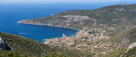 Obraz premium Panoramic view of Komiza town coastline from Mount Hum on Vis Island in Split Dalmatia region in Croatia