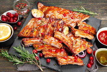 Delicious marinated grilled barbecue spare ribs with different sauces