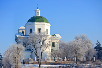 church with white walls and green dome