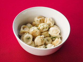 Fried dumplings with dill in a plate