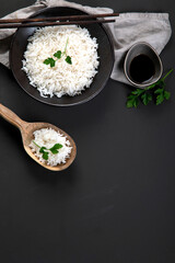Asian-style boiled rice with chopsticks on the side