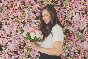 Portrait of beautiful woman with rose flowers on pink floral blossom background