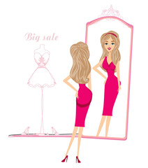 beautiful shopping girl looks at herself in the mirror