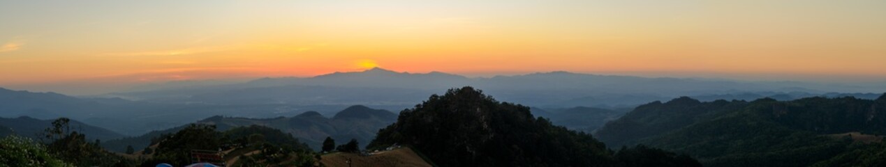 Fototapeta na wymiar Panorama or panoramic photo of Sunset or evening with mountain hill at Sri Nan National Park Doi Samer Dao Nan Province Thailand, Asia.