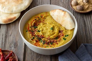 Hummus with seasonings and pita. Healthy eating. Vegetarian food. Diet.