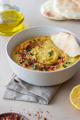 Hummus with seasonings and pita. Healthy eating. Vegetarian food. Diet.