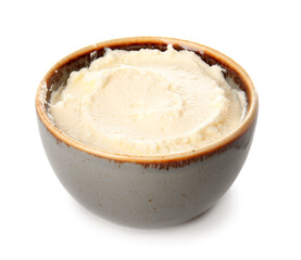 Bowl with tasty cream cheese on white background