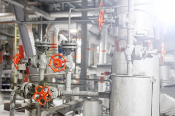 Red valves and chemical pipes in the factory