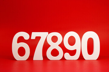 Counting numbers ( 6 7 8 9 0 ) white number wooden on Red Background with Copy Space - Six Seven Eight Nine Zero