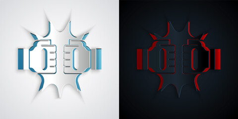 Paper cut Punch in boxing gloves icon isolated on grey and black background. Boxing gloves hitting together with explosive. Paper art style. Vector.
