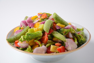 Frozen vegetable mixture of carrots, broccoli ,peppers, red onion and peas. Healthy food