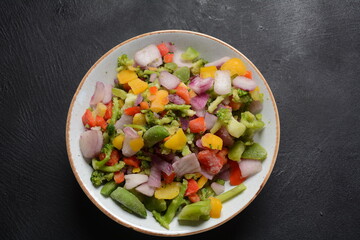 Frozen vegetable mixture of carrots, broccoli ,peppers, red onion and peas. Healthy food