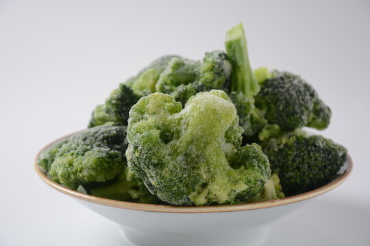 Small frozen  broccoli pieces.  Healthy food. Frozen vegetables