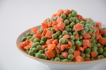 Frozen vegetable mixture of carrots and peas. Healthy food