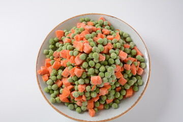 Frozen vegetable mixture of carrots and peas. Healthy food
