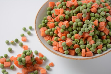 Frozen vegetable mixture of carrots and peas. Healthy food