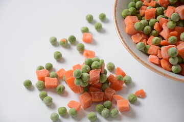 Frozen vegetable mixture of carrots and peas. Healthy food