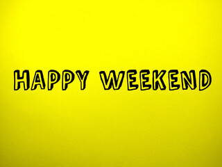 Selective focus.Word HAPPY WEEKEND on yellow background.Holiday concept.