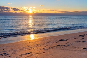 Fototapeta na wymiar Golden sunset on the sandy shores of the Black Sea