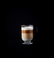 Coffee with milk on dark background. Copy space. 