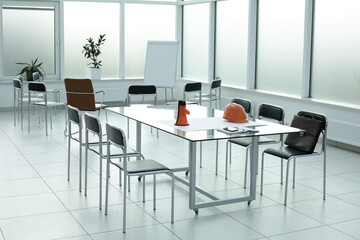 Loudspeaker construction helmet chairs diary briefcase phone glass table in a bright office
