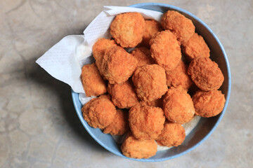 fried chicken pop nuggets in a cup.