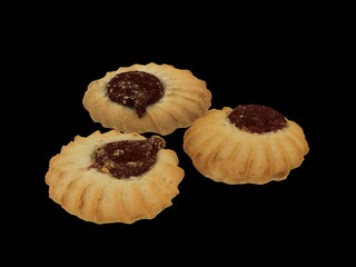 cookies with jam on black background