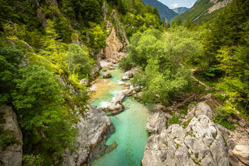 Long exposure of a vivid turquoise Soca river valley near Bovec in Triglav National Park, Julian Alps, Slovenia Europe.