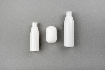 Skin and body care spa set on abstract gray background. Anti aging and acne massage routine. Top horizontal view copyspace.