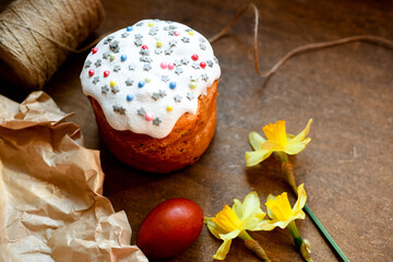 Easter, Easter cake on a dark background with a complex composition, decorated with flowers, Happy Easter Holidays, colorful eggs