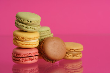 Colorful french macarons on background