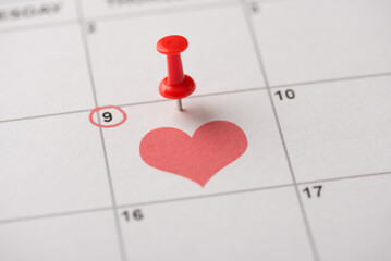 Happy mother's day concept. Close up view photo image of red thumb tack attached to calendar with date and heart - Powered by Adobe