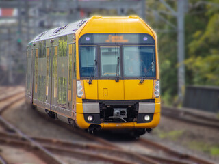 Fototapeta na wymiar Commuter train approaching train station in Sydney NSW Australia