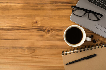 Study at home concept. Overhead above flat lay close up view photo picture of laptop keyboard mug with espresso spiral craft copybook with pen isolated brown backdrop with blank empty place
