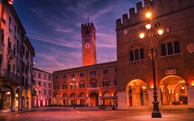 Fototapeta na wymiar 14 february 2021, Treviso, Italy: Piazza dei Signori (Lord's Square) in Treviso at dawn. On the background the city Tower, on the right Palazzo dei Trecento