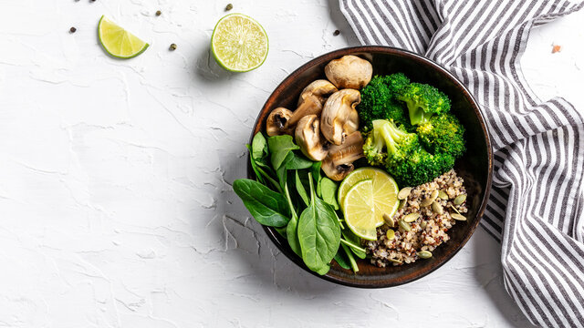 Diet Salad Made From Fresh Vegetables Broccoli, Mushrooms, Spinach And Quinoa In A Bowl. Delicious Breakfast Or Snack, Clean Eating, Dieting, Vegan Food Concept. Top View