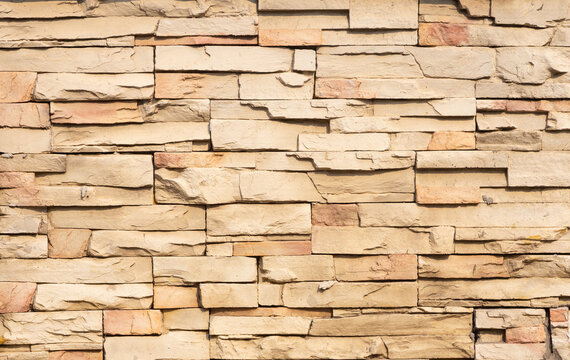 Yellow sand stone brick wall with natural texture in hi resolution, for background.